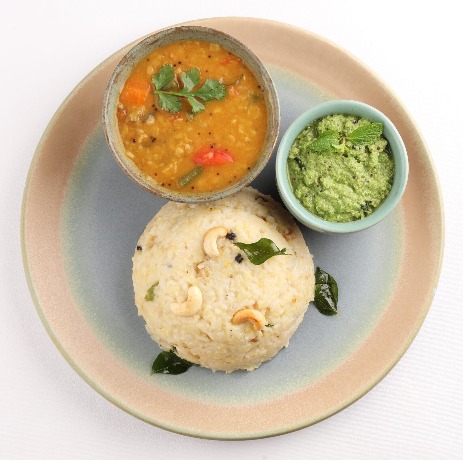 Ven Pongal Khara Pongal with Sambar coconut Chutney popular Indian breakfast food Tamil Nadu festival Pongal Sankranti Diwali spicy pongal prepared with rice lentil semolina rava South India Sri Lanka